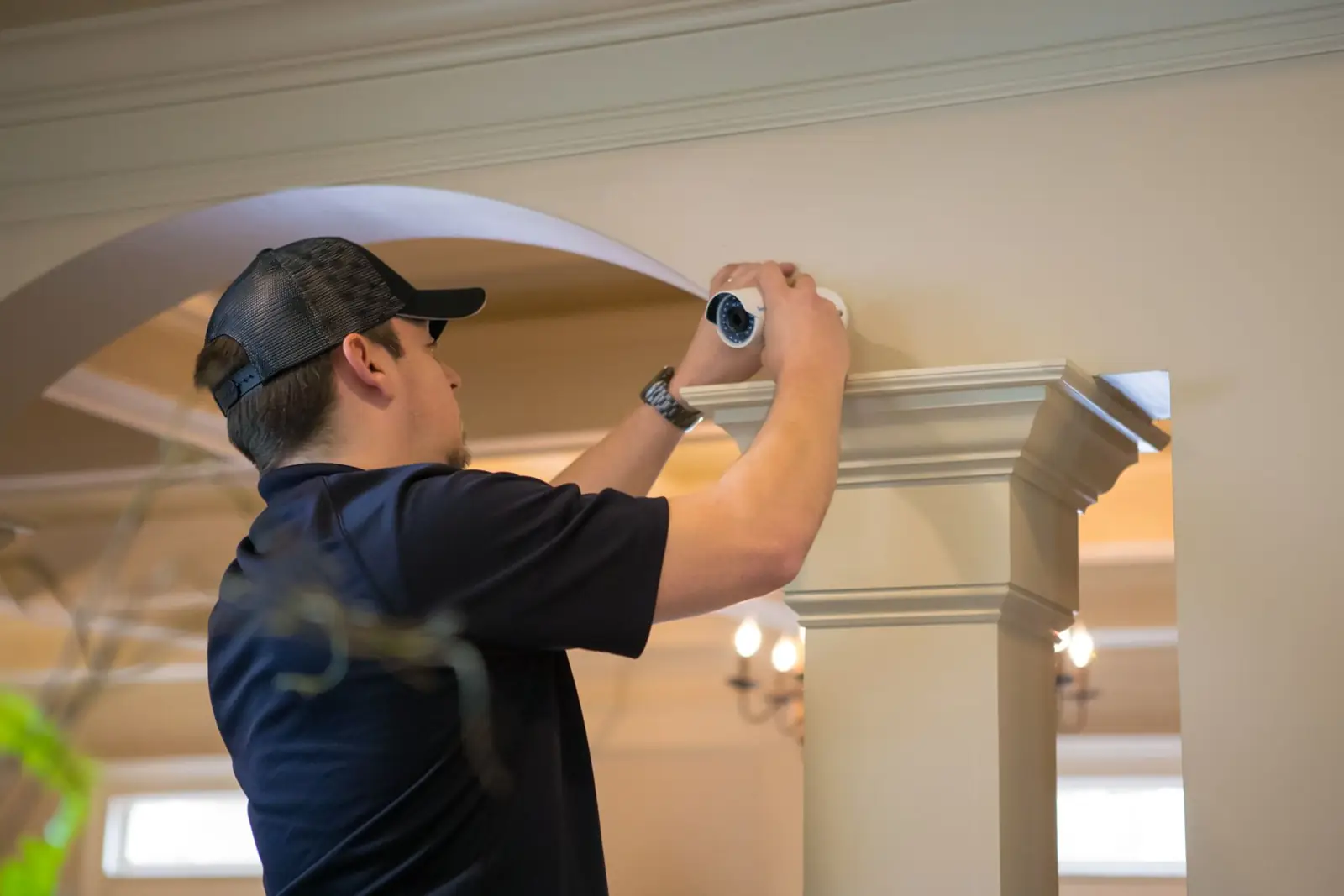 Owen technician installing a security system